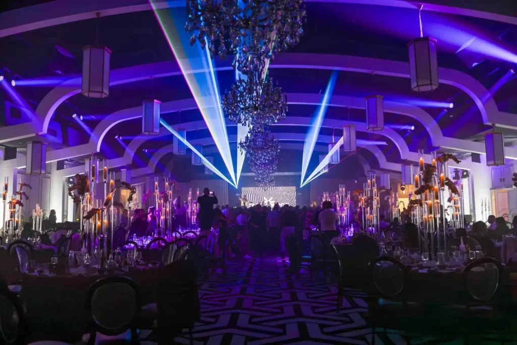 Event venue lighting setup with programmable moving heads and static fixtures