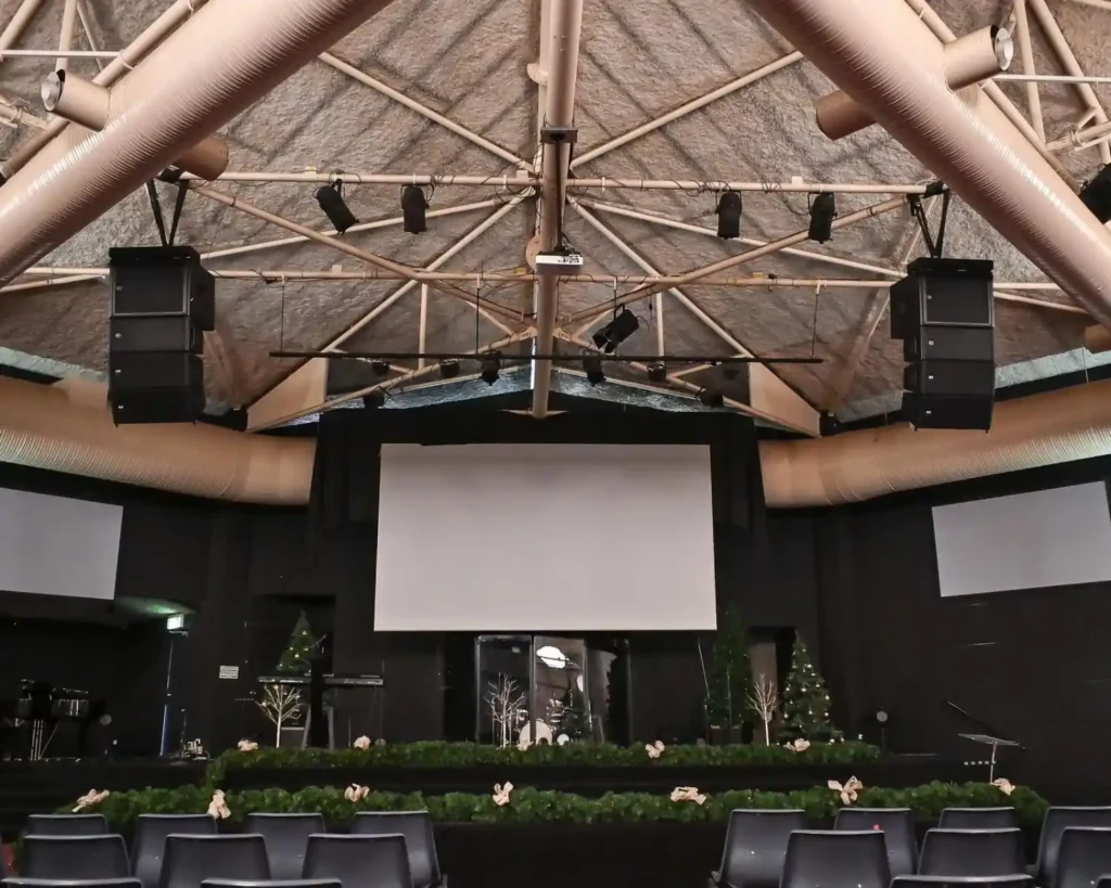 Line array speakers in event venue.