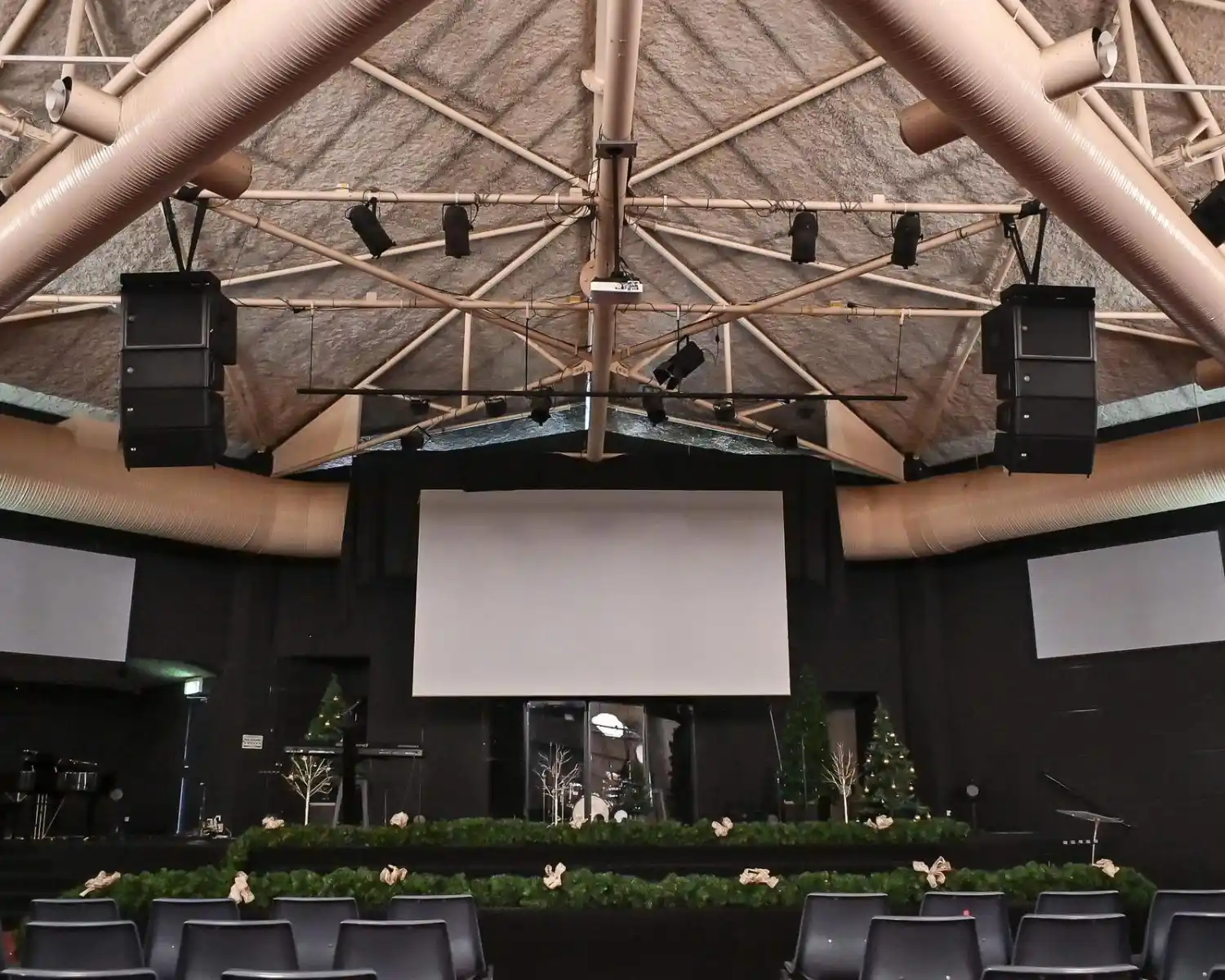 Line array speakers in event venue.