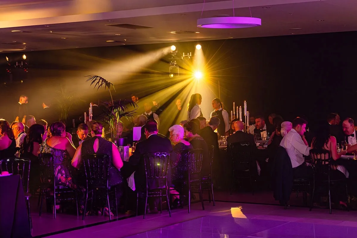 Crowded nightclub dance floor lighting