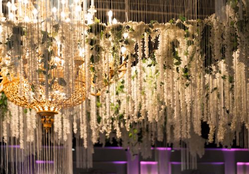 Wedding event setup with elegant lighting and decorative AV equipment in Sydney.