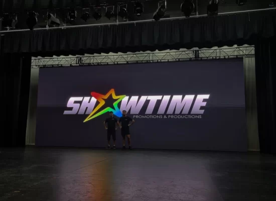 Professional stage setup featuring large LED screen displays for conferences and presentations Professional stage setup featuring large LED screen displays for conferences and presentations